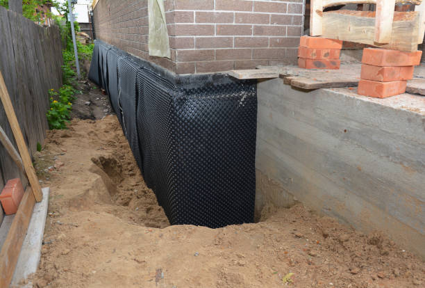 Happy homeowners after waterproofing job in Drexel Hill